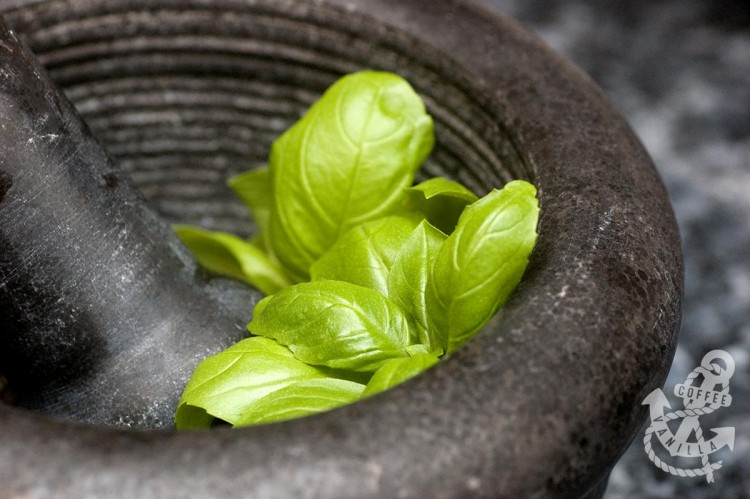 basil leaves in mortar and pestle 