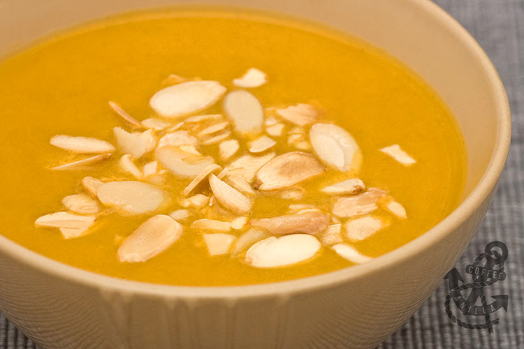 creamy pumpkin soup with roasted almond flakes