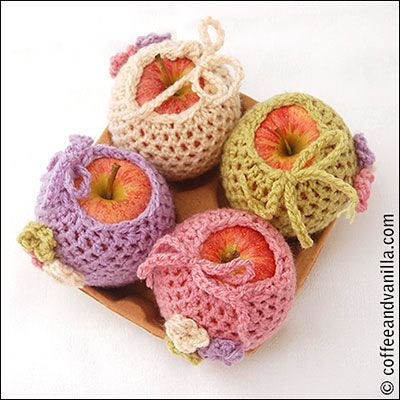 apple cosies with flower motifs