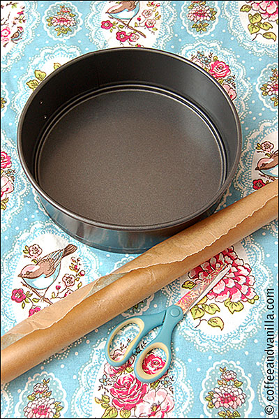 lining loose base cake tin with parchment paper