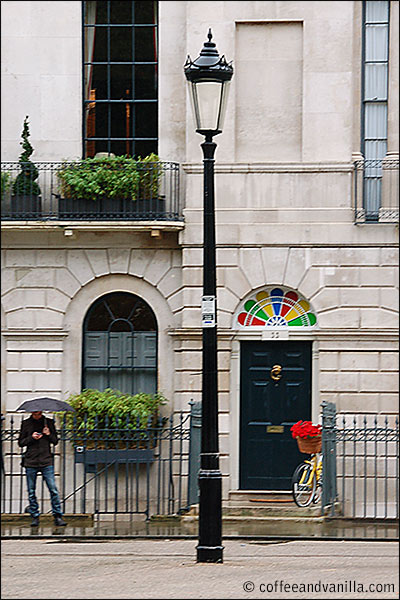 Google black door with G shaped knocker