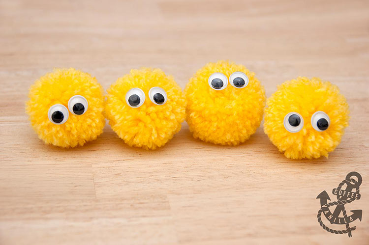 cute pom pom creatures with googly eyes