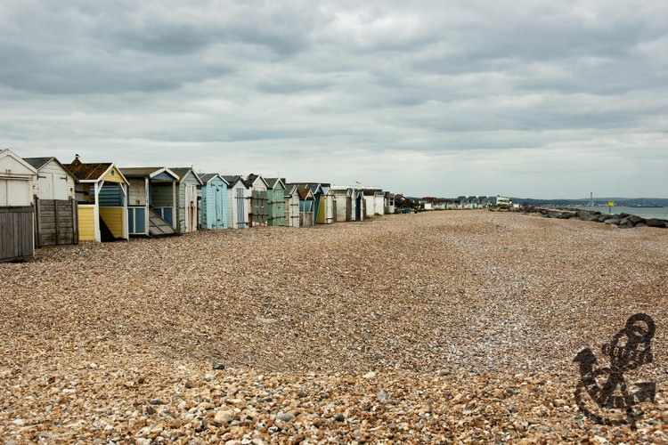 Lancing seafront with shingle beach huts 